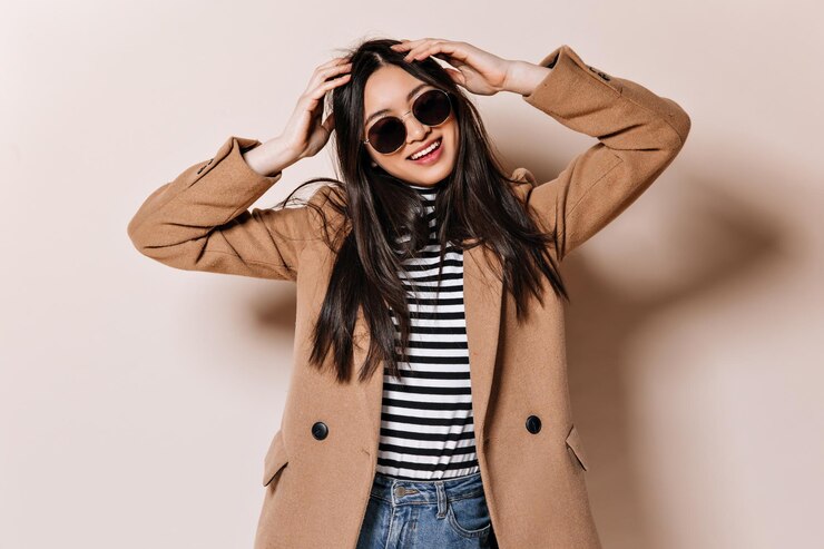 charming woman beige coat sunglasses