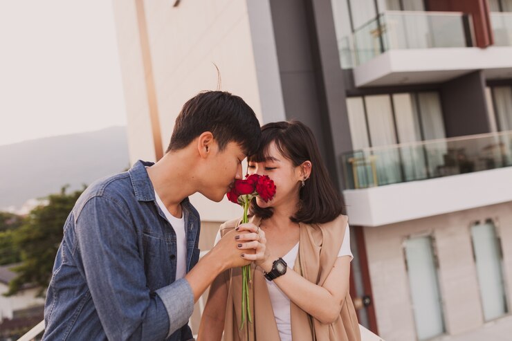 couple smelling rose